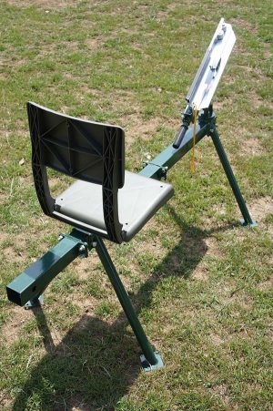 Seated single arm full cock clay trap